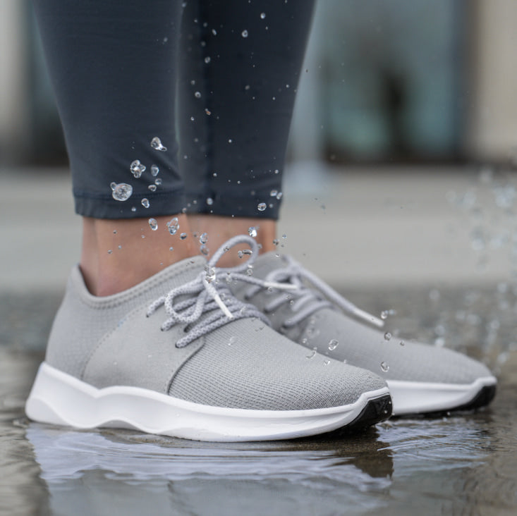 Grey sneakers with dense surface of texture for comfortable everyday  wearing · Free Stock Photo