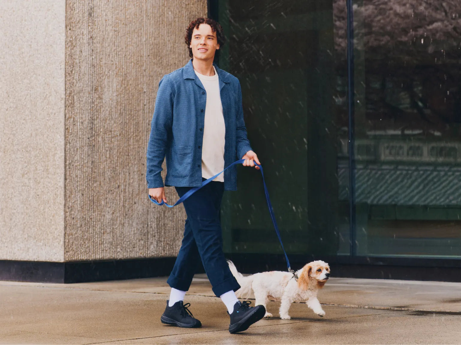 Dog walk in the rain wearing the Weekend Classic in Marble White
